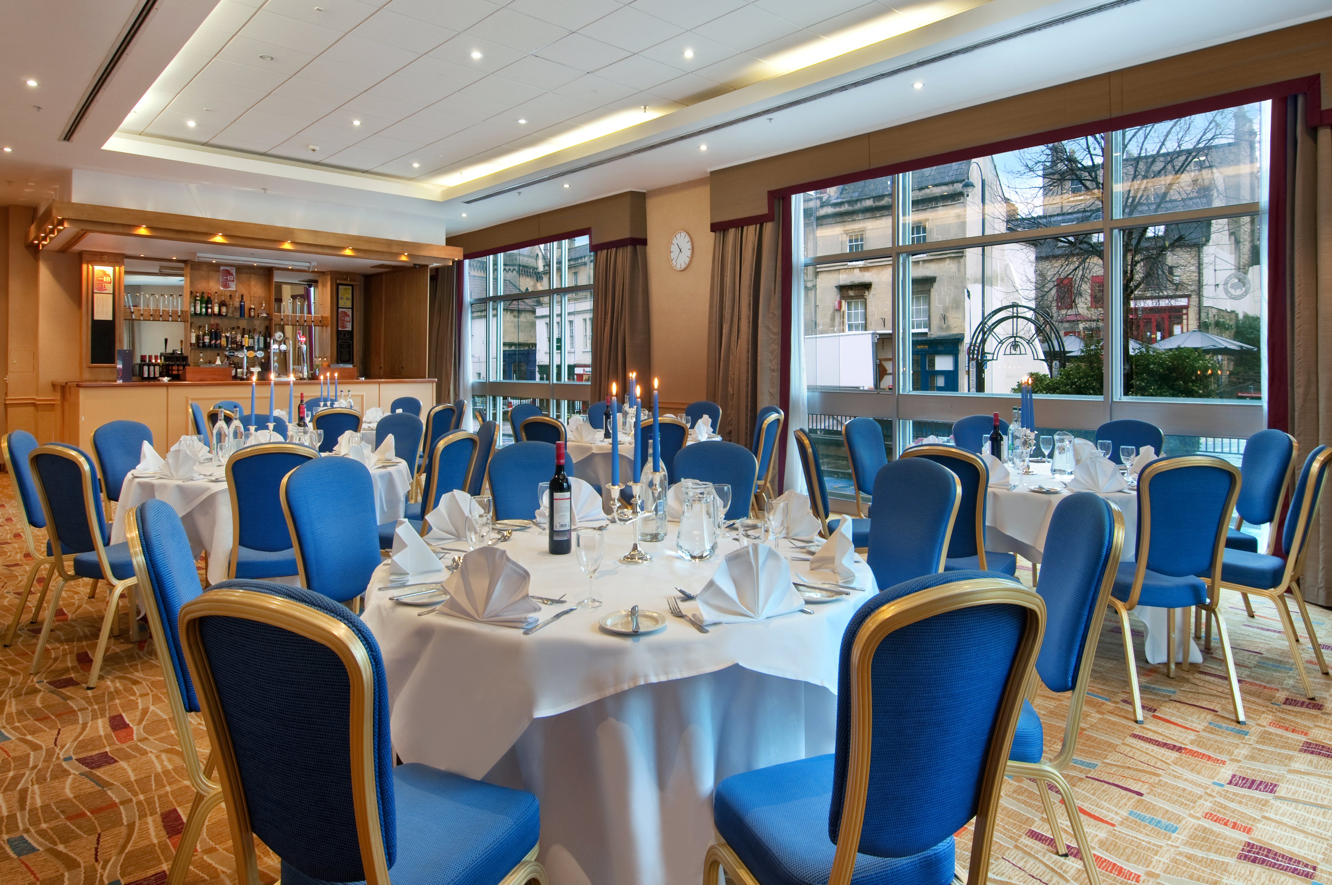 County Suite at Hilton Bath: Banquet setup with blue chairs for corporate dinners and receptions.