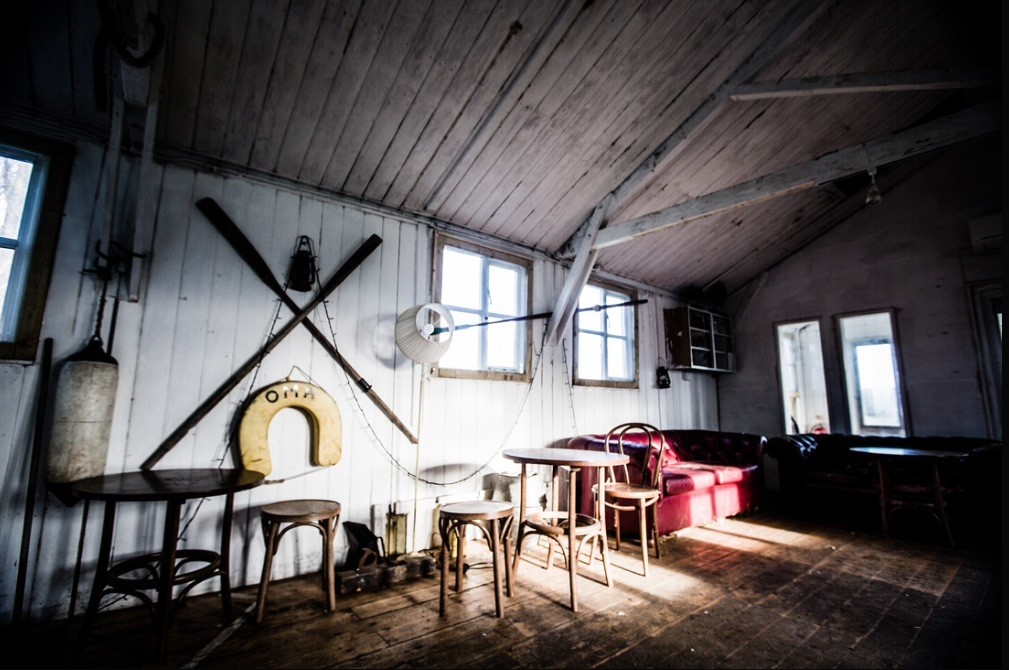 Rustic meeting space at The Shack, Osea Island, ideal for creative gatherings.