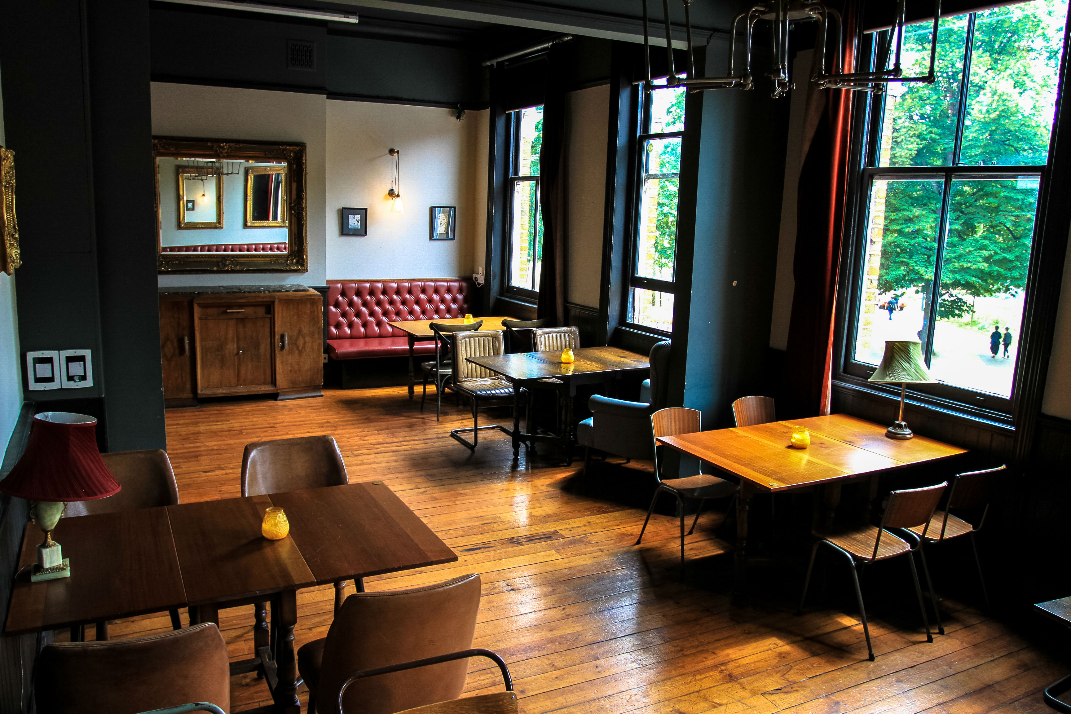 Stylish event space with wooden floors, ideal for workshops and networking.