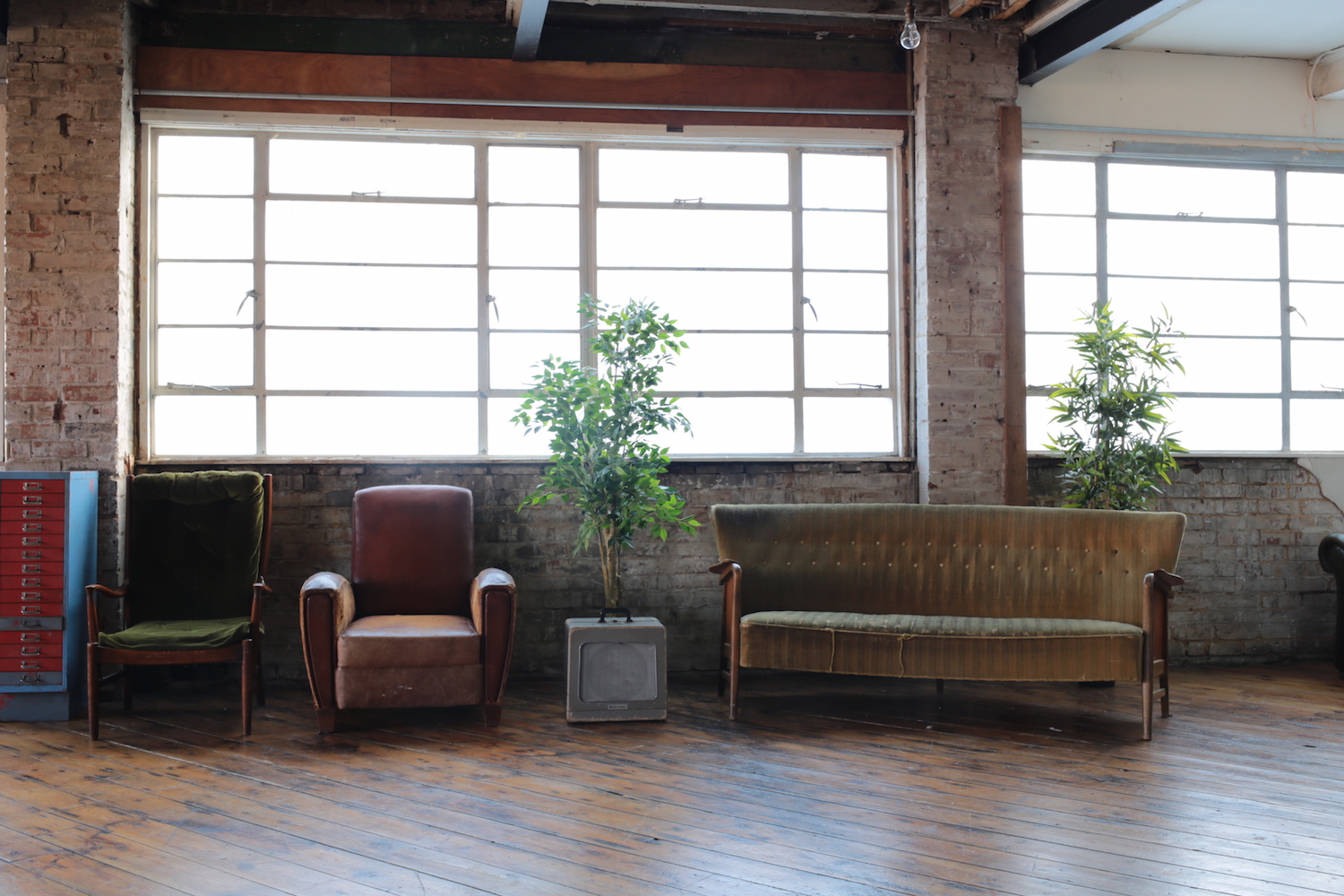 Cozy industrial seating area at Belt Craft Studios for networking events and meetings.