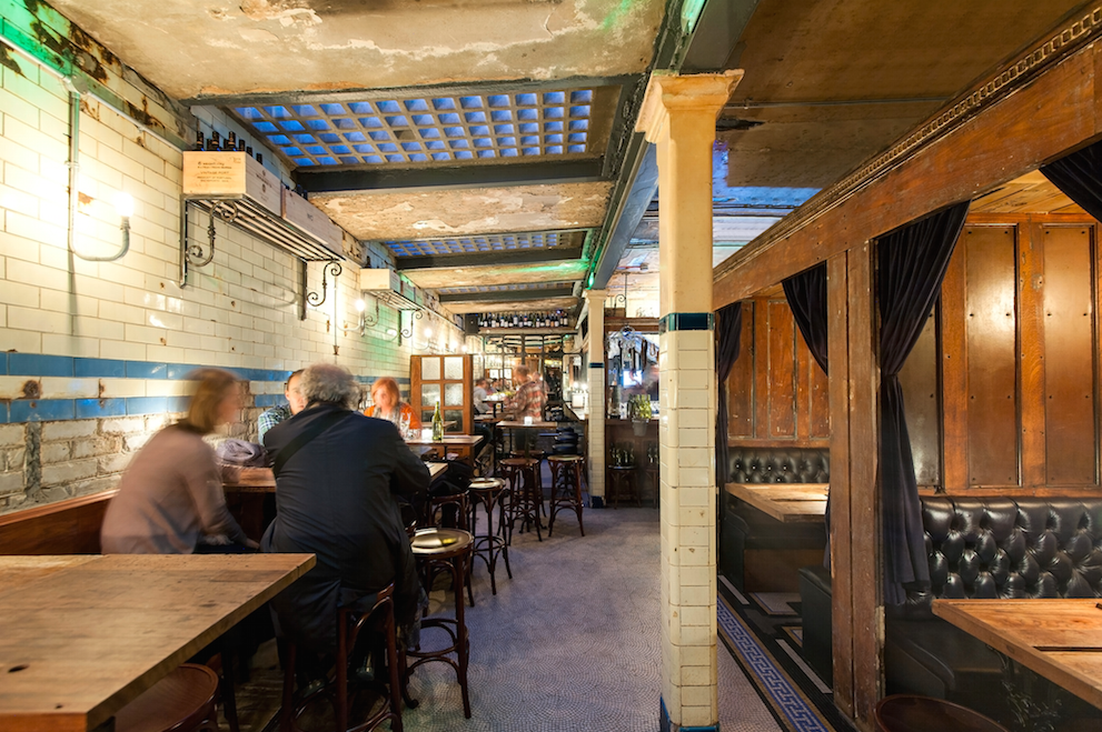 Cozy wine bar with rustic decor, perfect for networking events and intimate meetings.