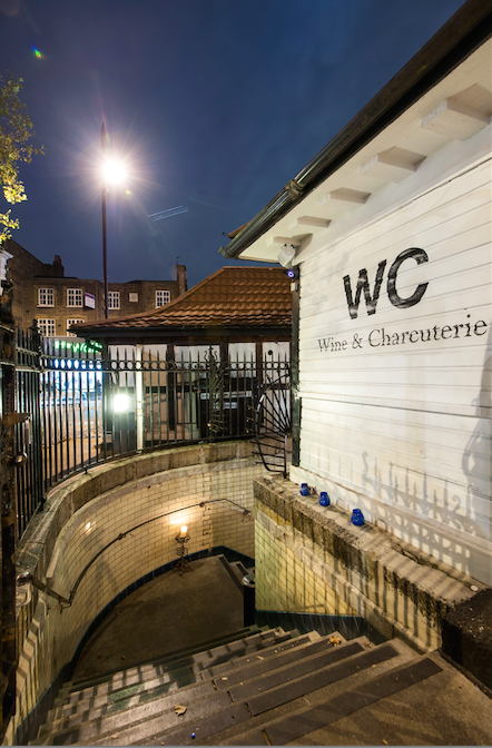 Wine bar entrance with warm lighting, ideal for intimate gatherings and networking events.