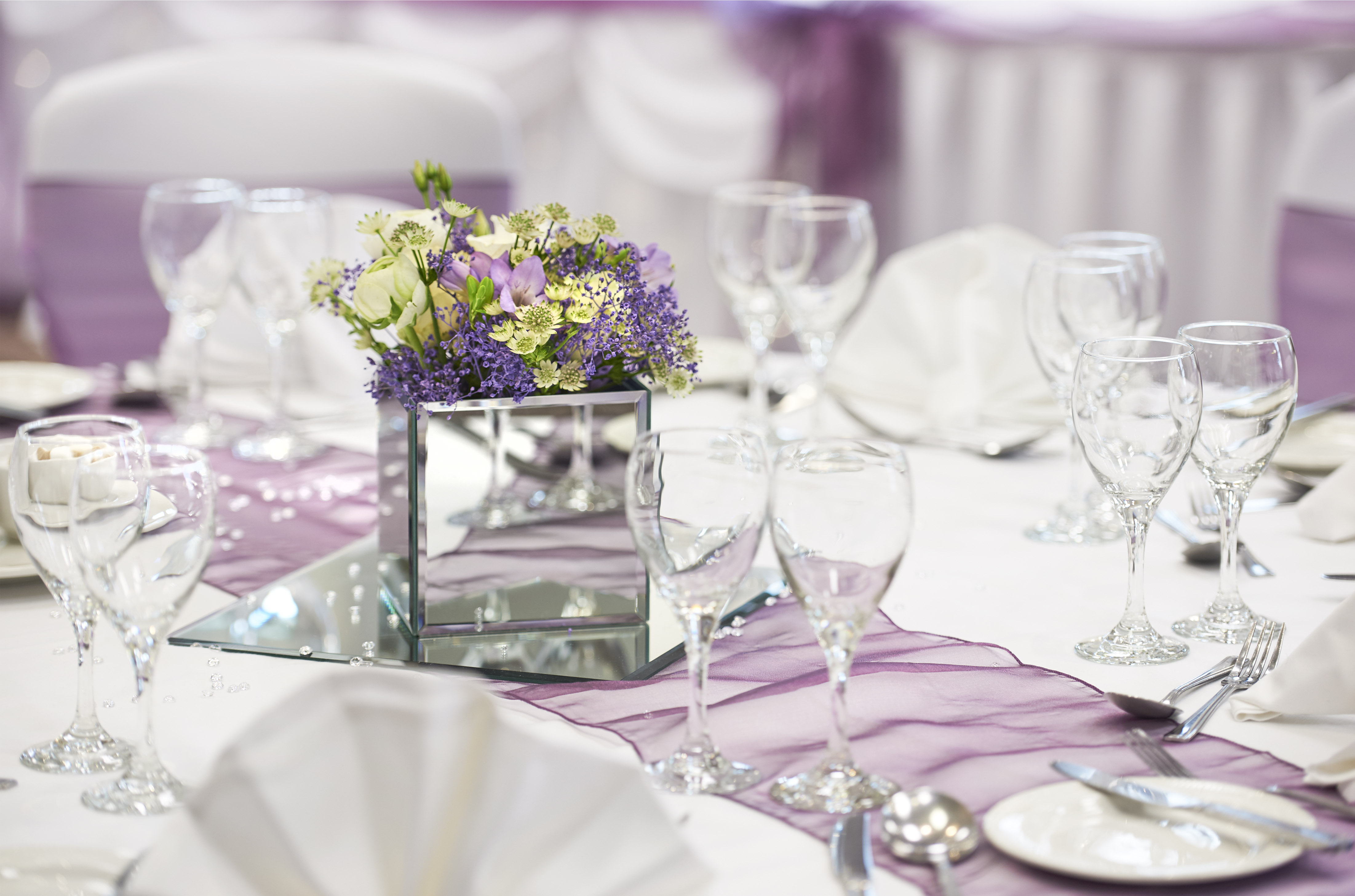 Elegant table setting with flowers in Gloucester Suite, perfect for weddings and events.