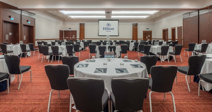 Windsor Suite at Hilton Reading: elegant meeting space for corporate events with round tables.