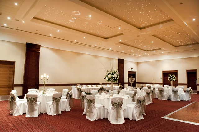 Windsor Suite at Hilton Reading, elegant wedding venue with white table settings and floral decor.