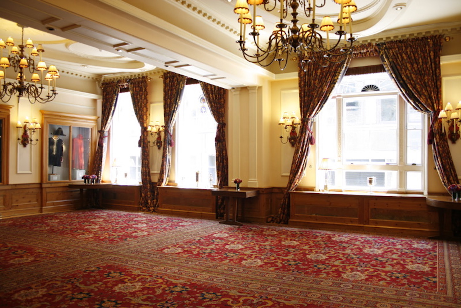 Elegant Watermen's Hall venue with chandeliers, perfect for upscale events and gatherings.