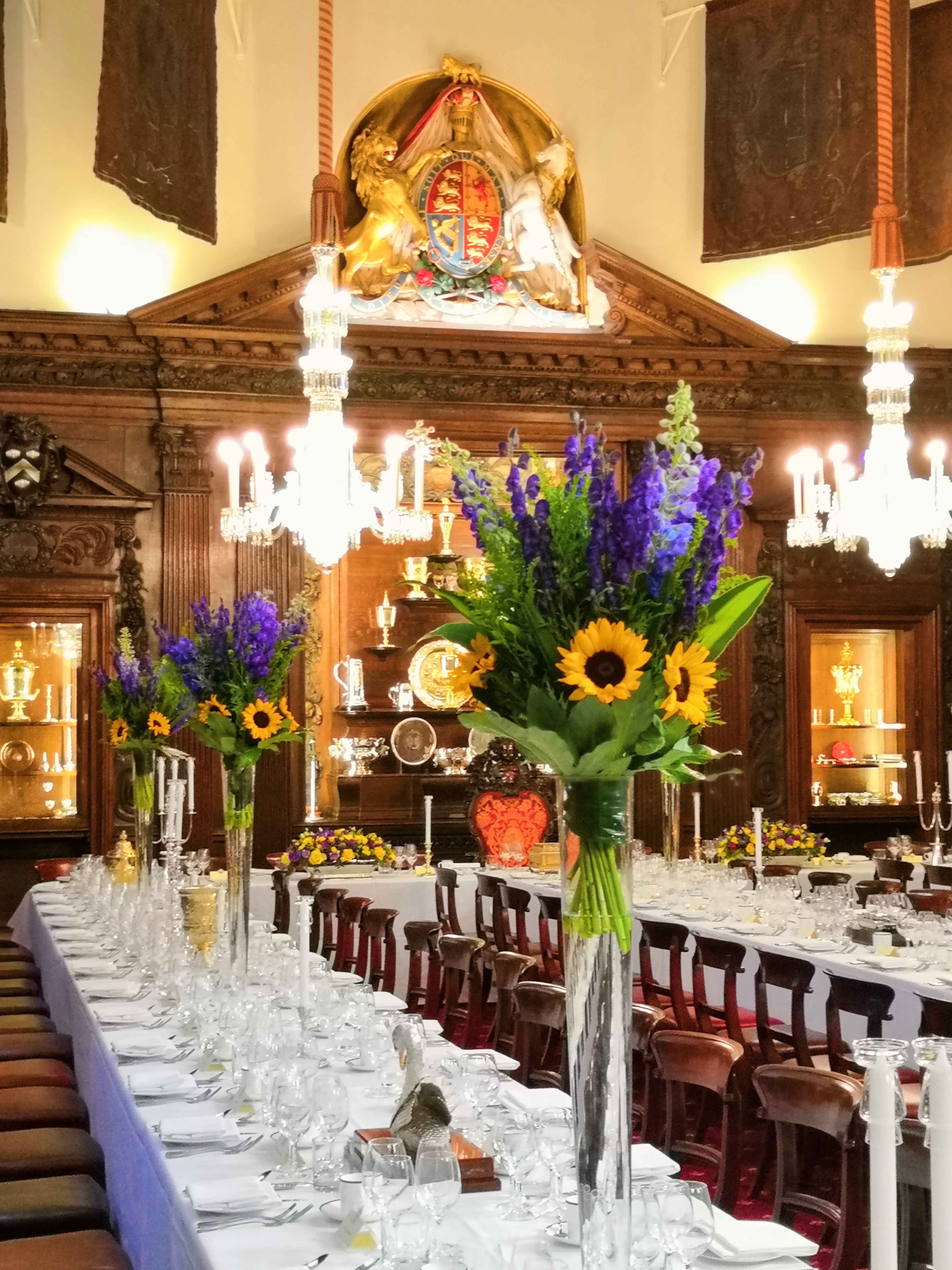 Elegant Livery Hall dining setup with floral arrangements for weddings and corporate events.