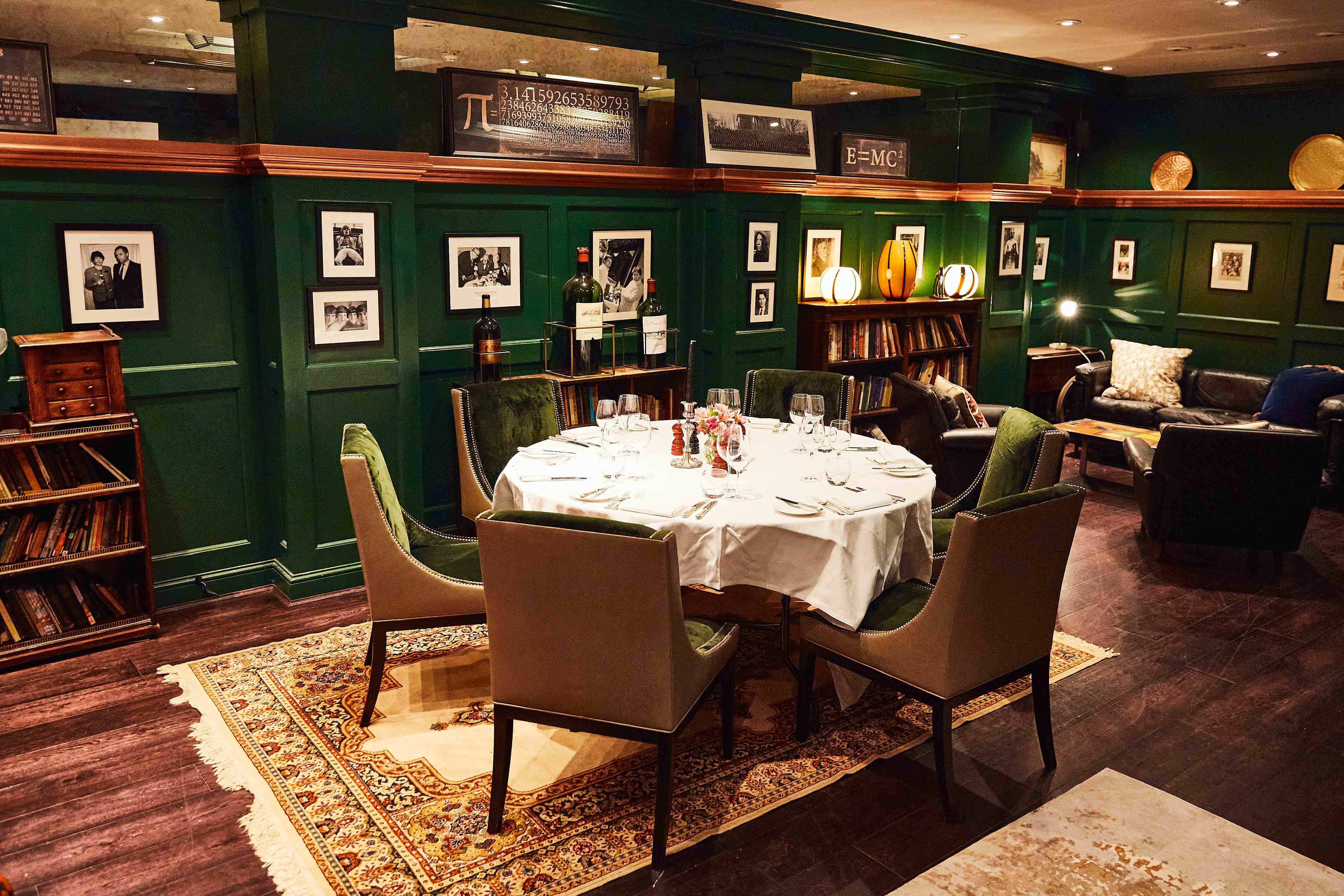 Elegant L'Escargot private dining room, green paneling, executive dinner, networking event.