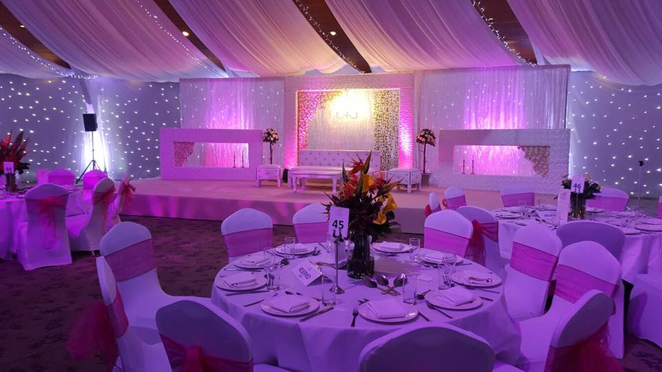 Elegant Starlite Suite with pink accents, perfect for weddings and upscale events.