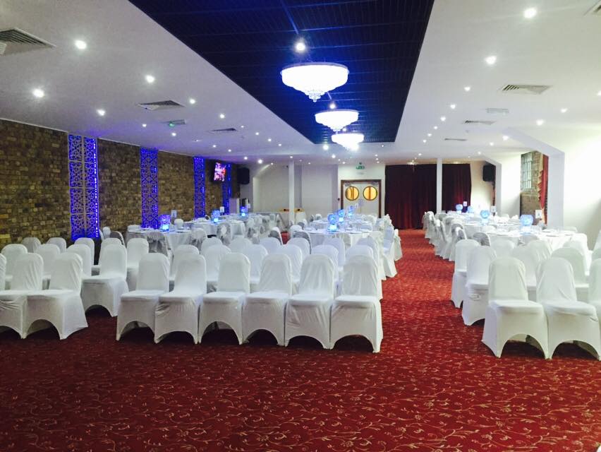 Starlite Suite at Regents Lake: elegant event space with white chairs for weddings and conferences.