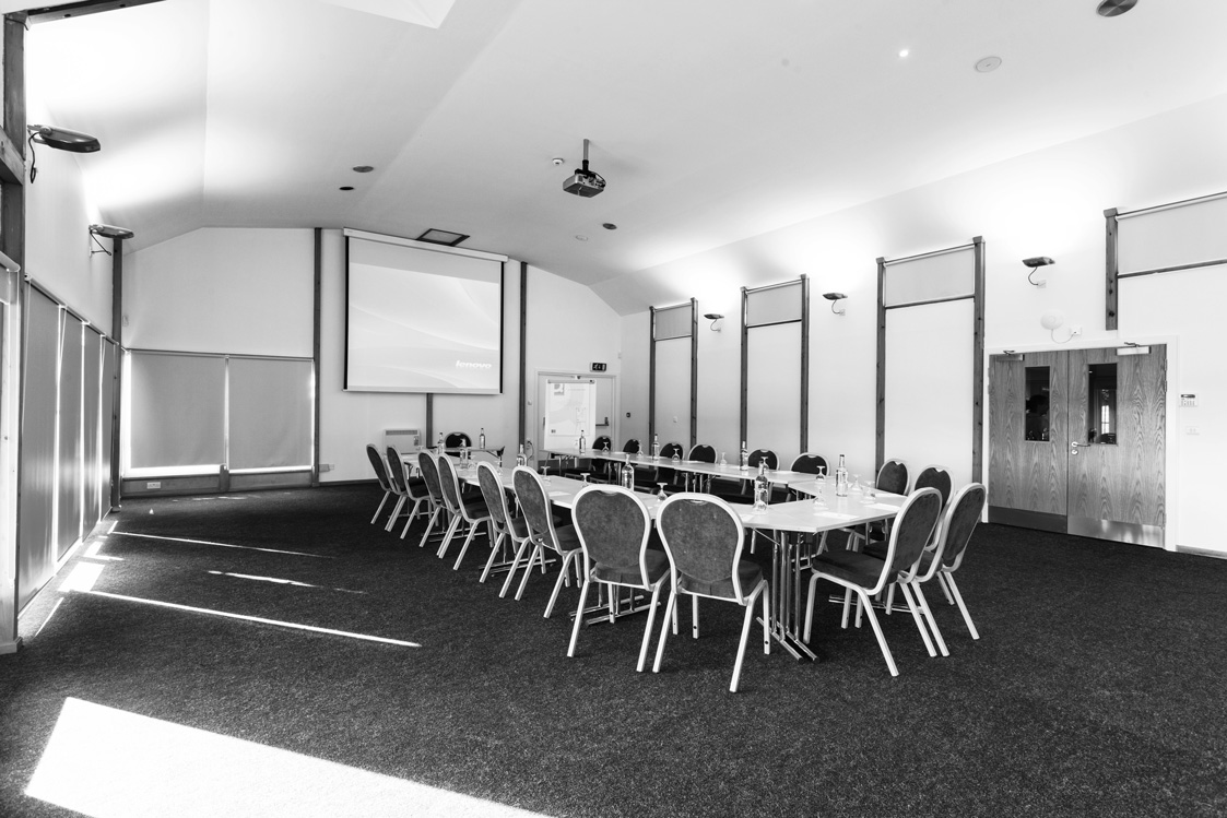 Astor Pavilion meeting room with U-shaped tables, ideal for conferences and workshops.