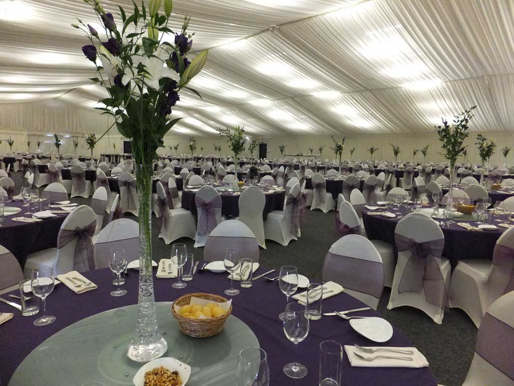 Clive Emson Conference Hall with elegant tables, perfect for weddings and corporate events.