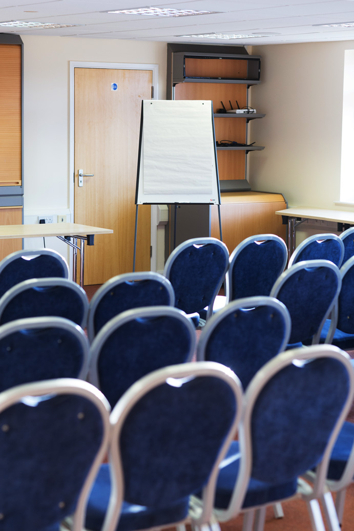 Detling Room at Kent Event Centre with blue chairs for presentations and workshops.