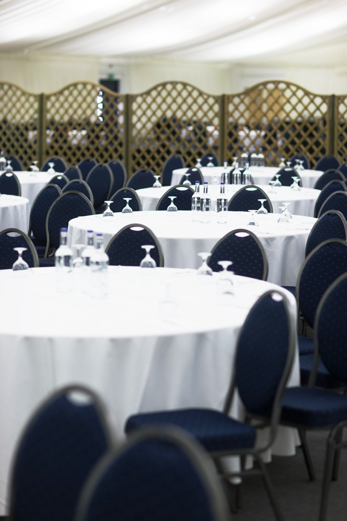 Stockbury Room at Kent Event Centre, elegant round tables set for networking event.