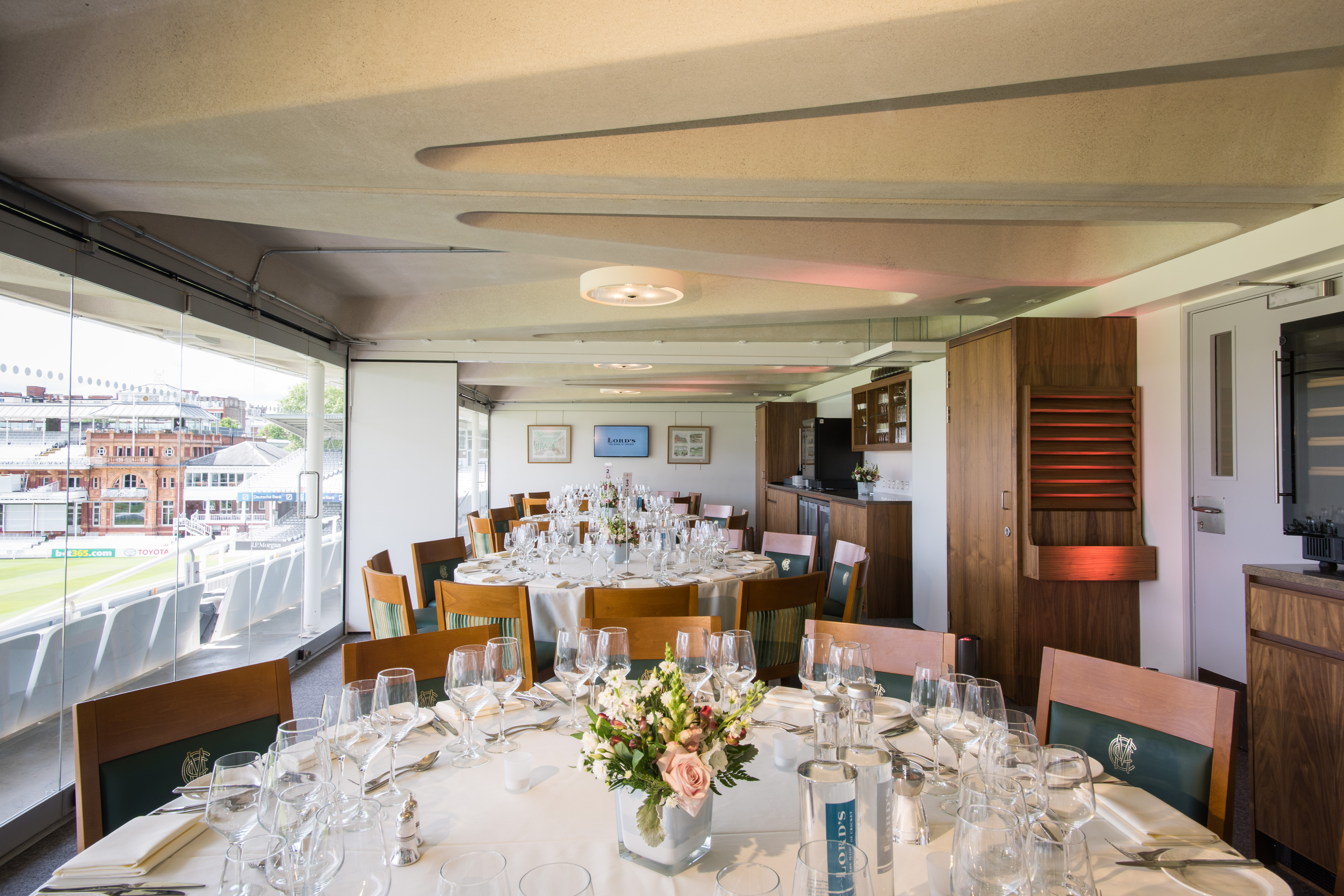 The President's Box at Lord's Cricket Ground, elegant dining setup for corporate events.