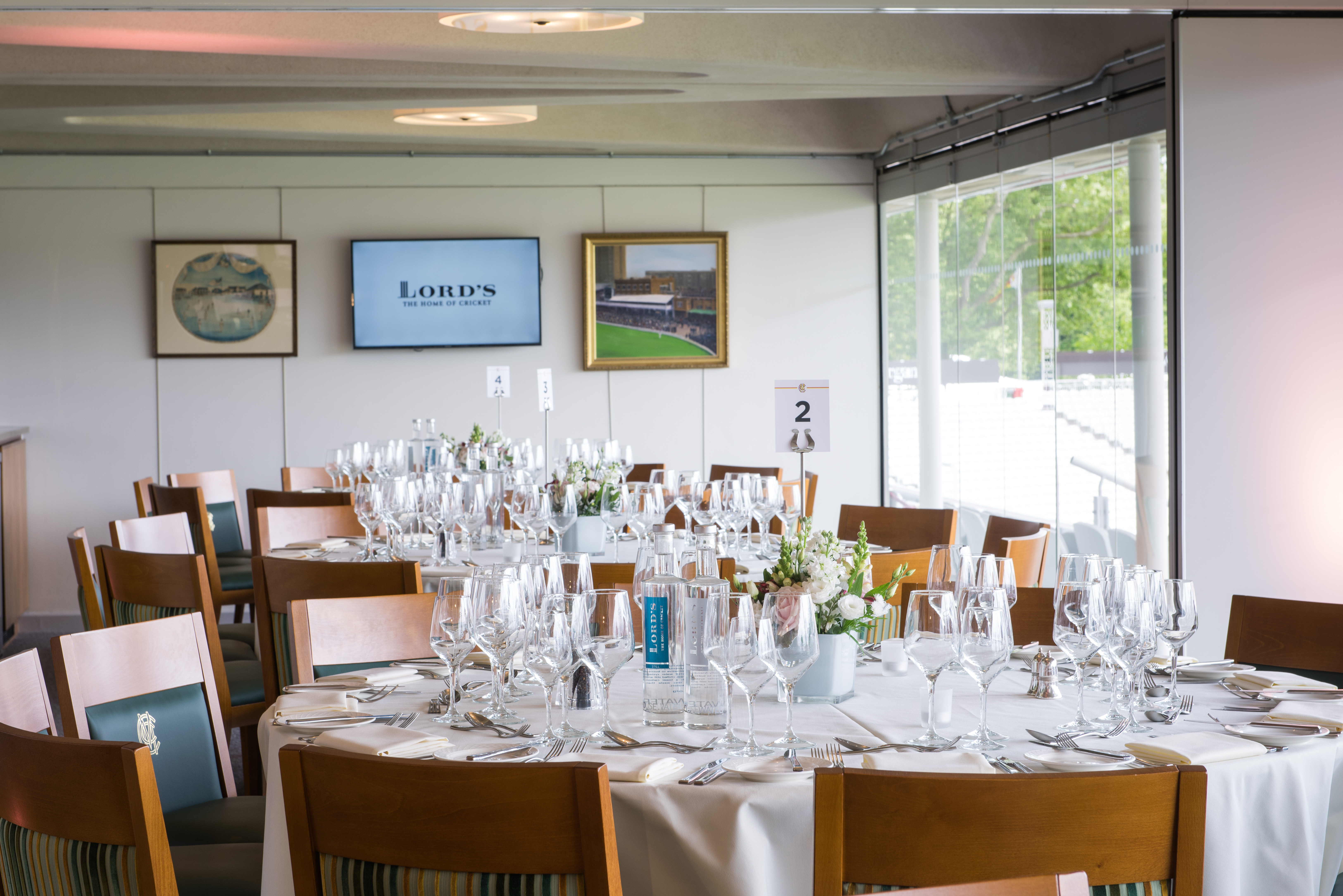 The President's Box at Lord's Cricket Ground, elegant dining setup for corporate events.