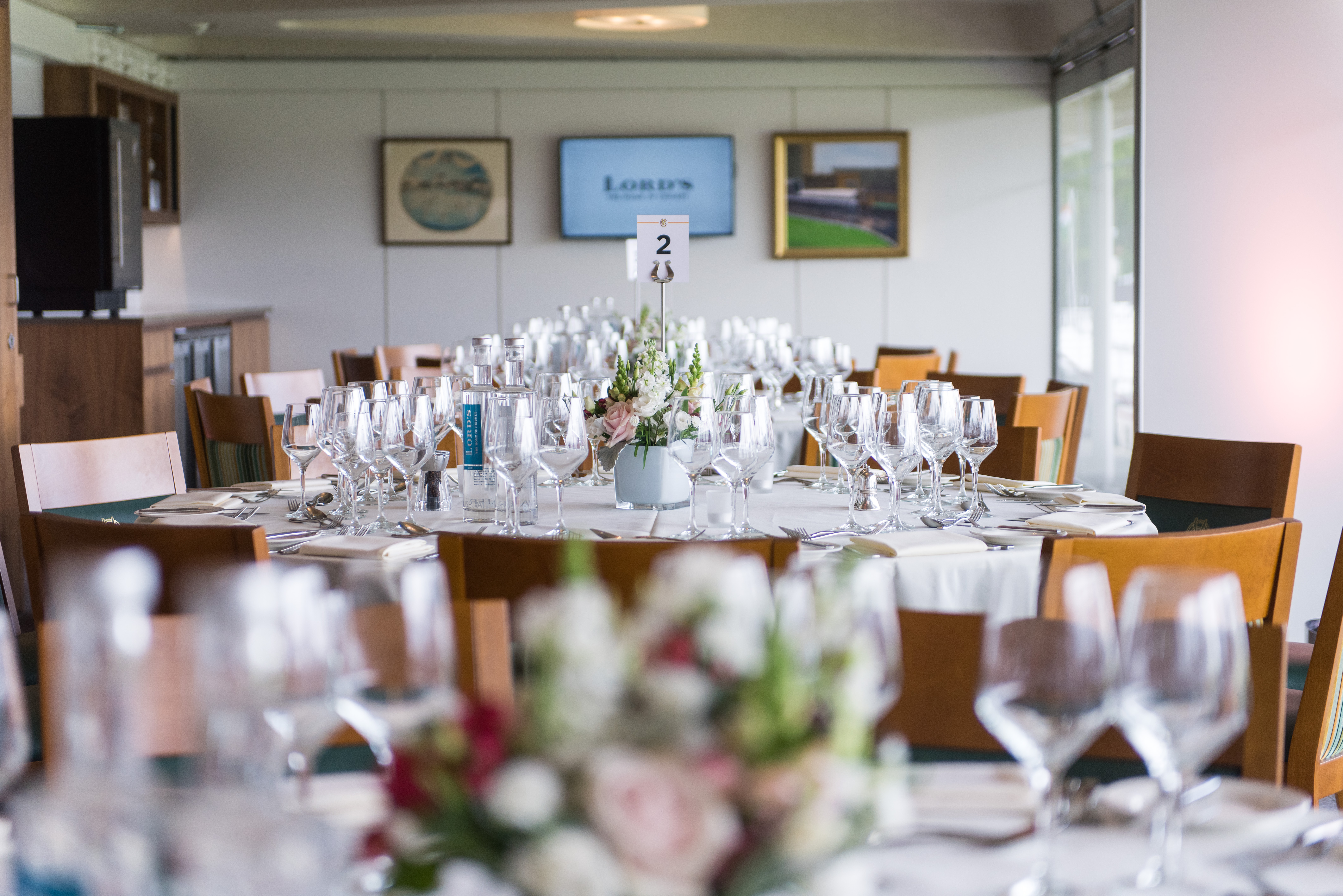 Elegant dining setup in The President's Box, Lord's Cricket Ground for corporate events.