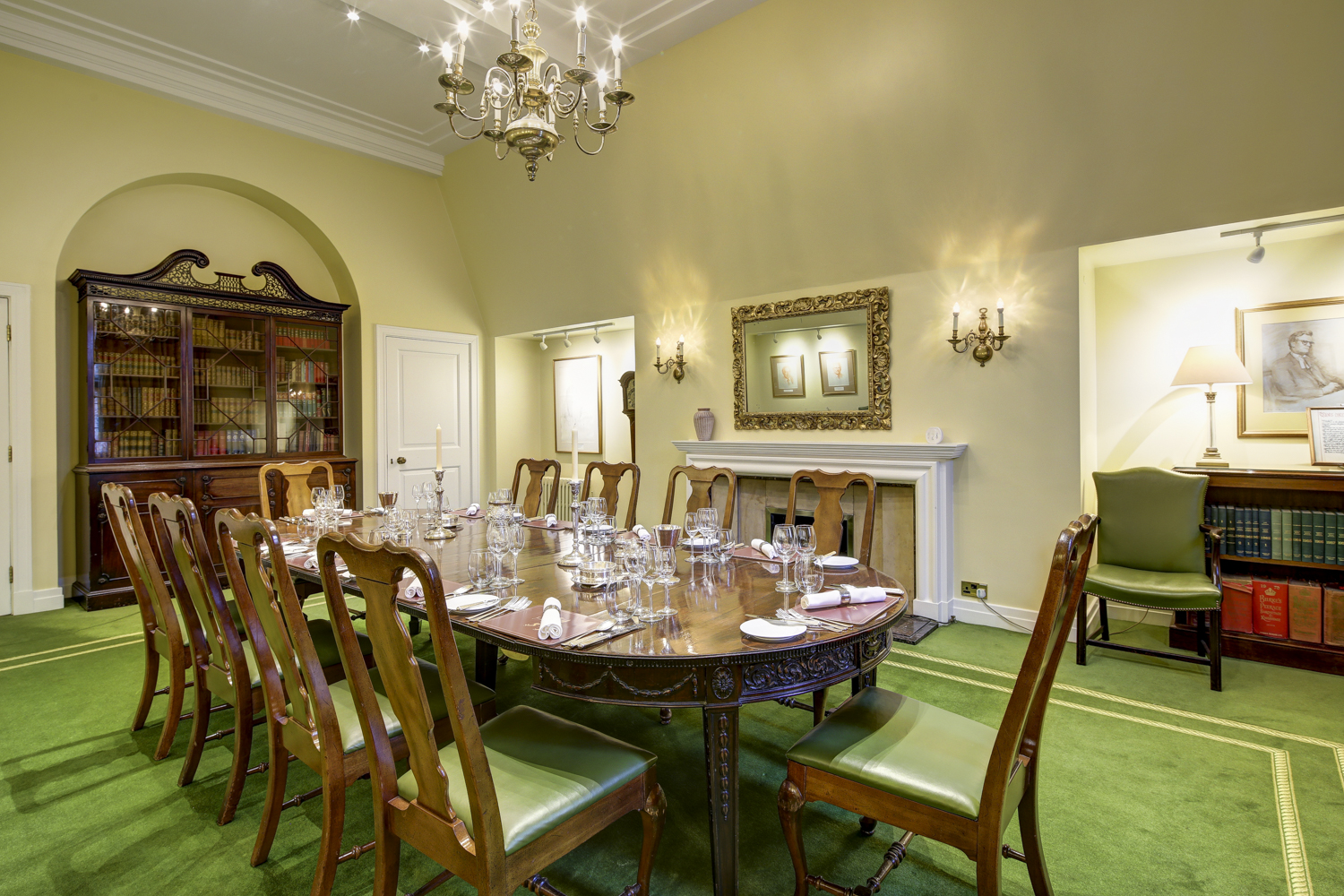 Elegant meeting room with wooden table, ideal for formal events and gatherings.