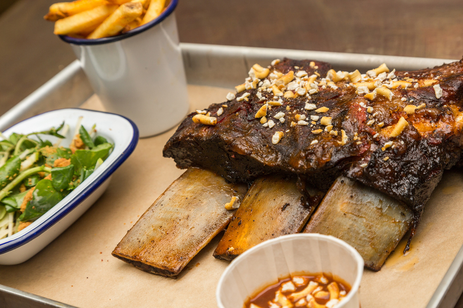 Succulent ribs with peanuts, salad, and fries at Liars Lounge event catering.