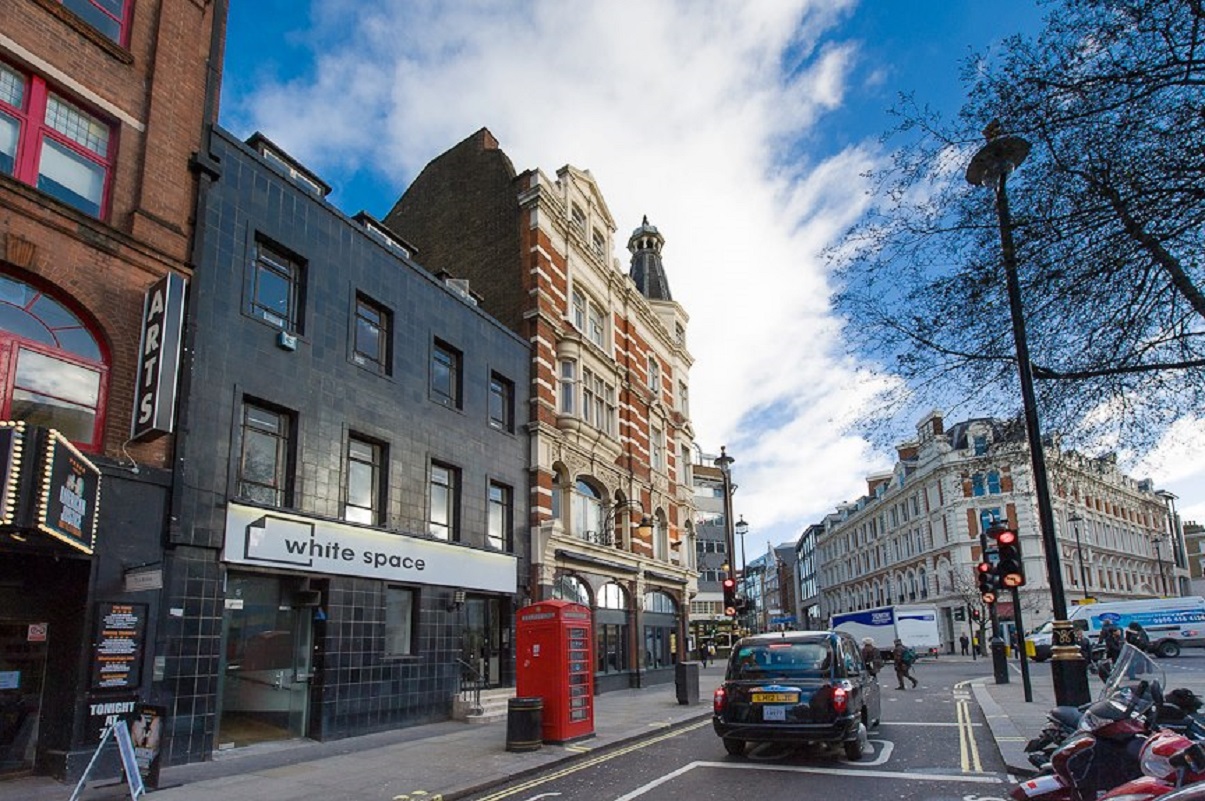 Vibrant urban event space with modern architecture and clear skies for networking.