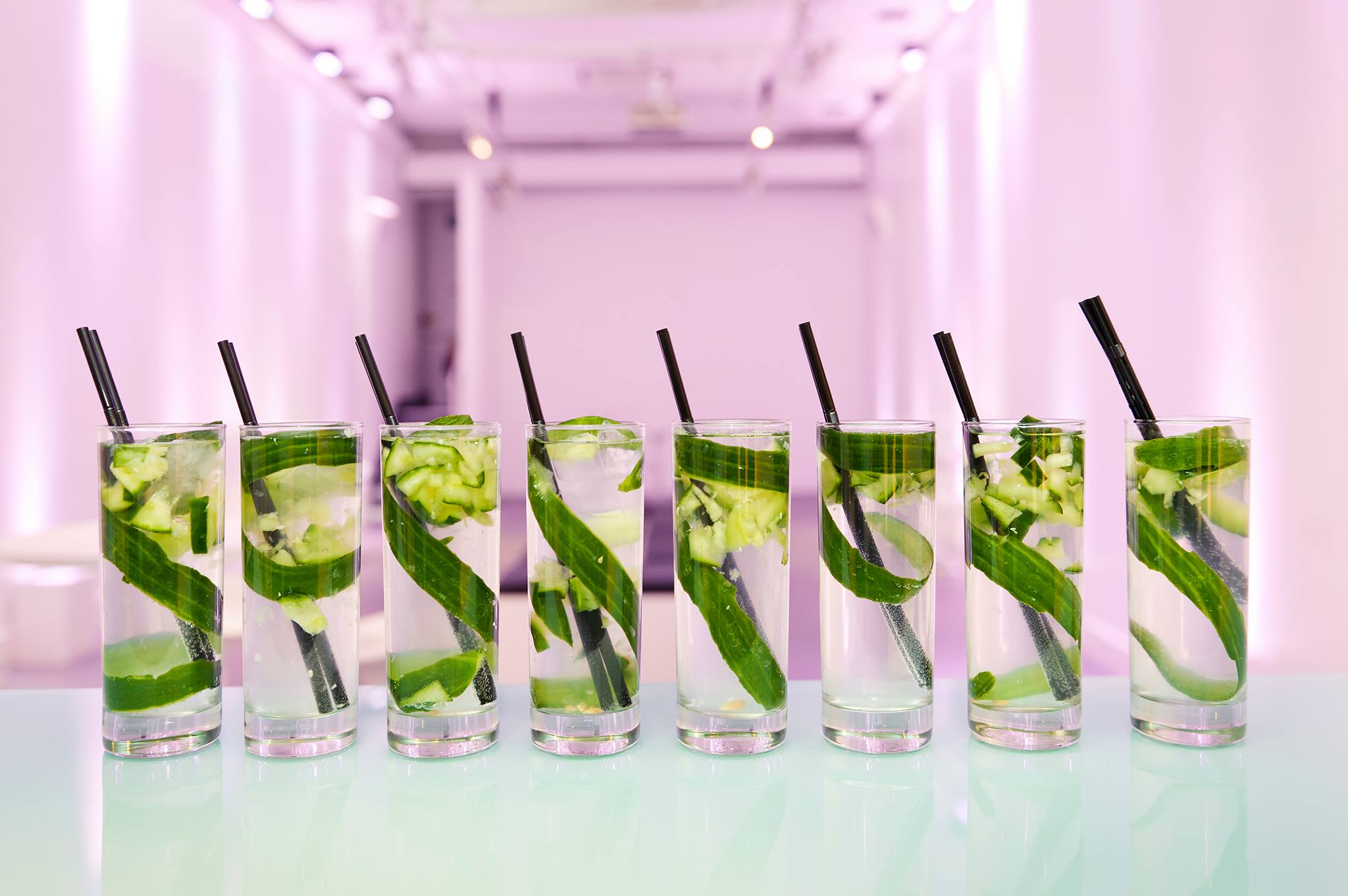 Cucumber-infused drinks in clear glasses for summer networking events.