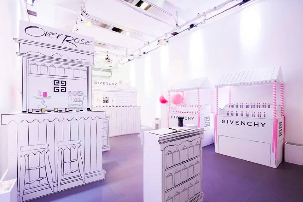 Whimsical event space with illustrated booths for luxury brands, ideal for product launches.