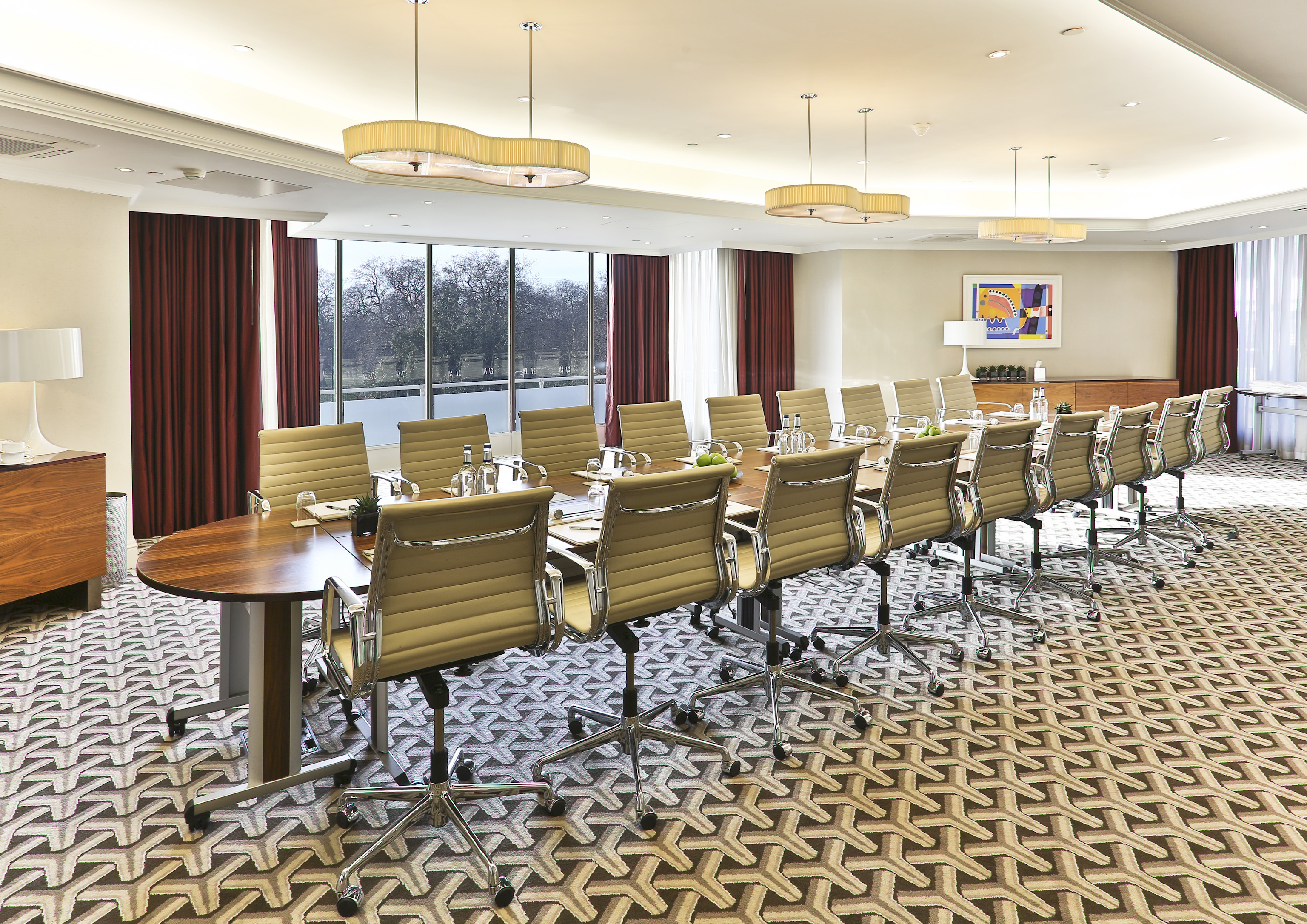 Serpentine Suite conference room with polished table, ideal for corporate events in London.