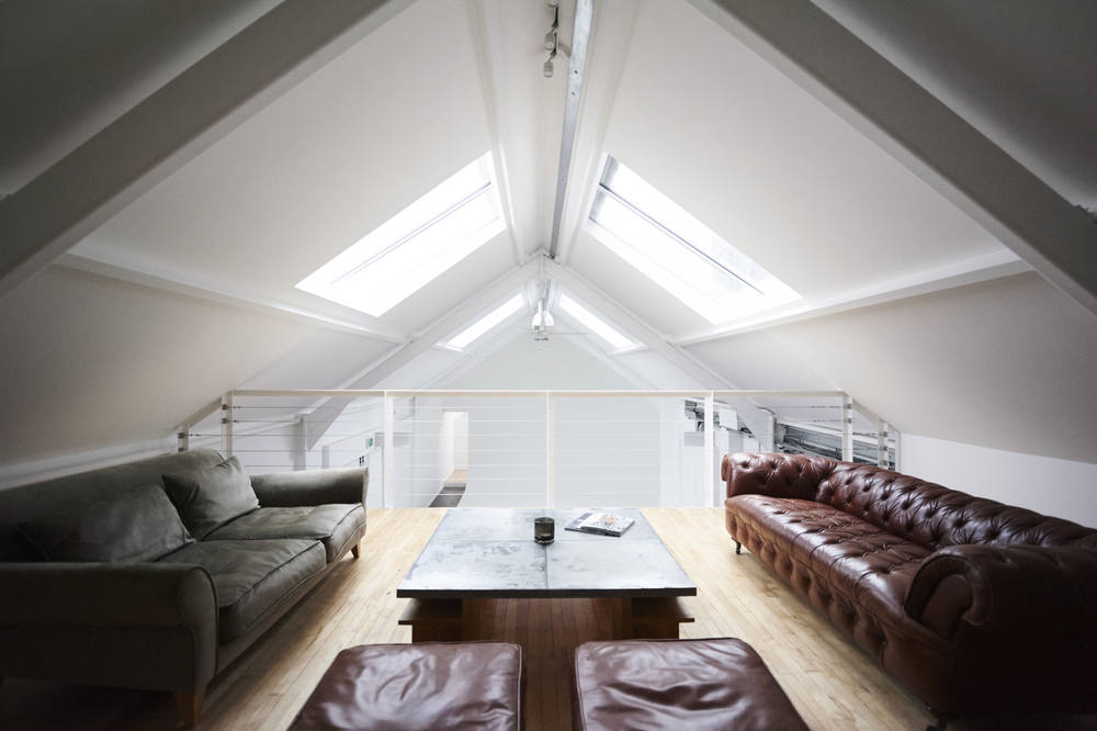 Modern loft space with natural light for creative meetings and brainstorming sessions.