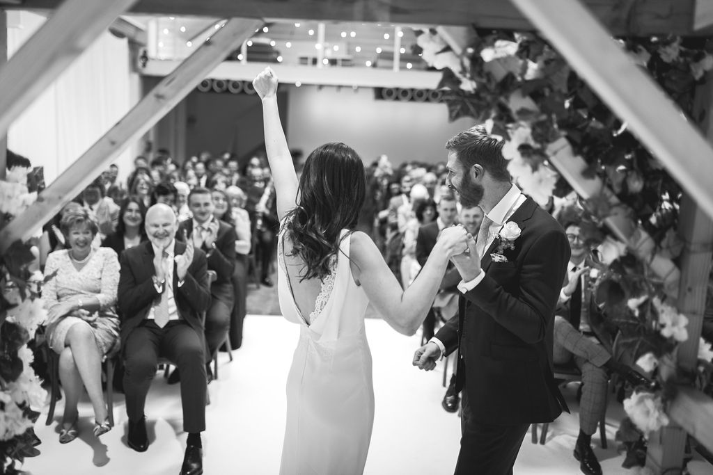 Joyful wedding ceremony at fivefourstudios with elegant decor and emotional connections.