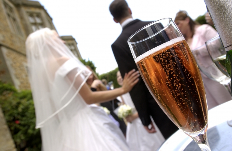 Champagne glass at a wedding in Manor House, Tracy Park, celebrating love and joy.