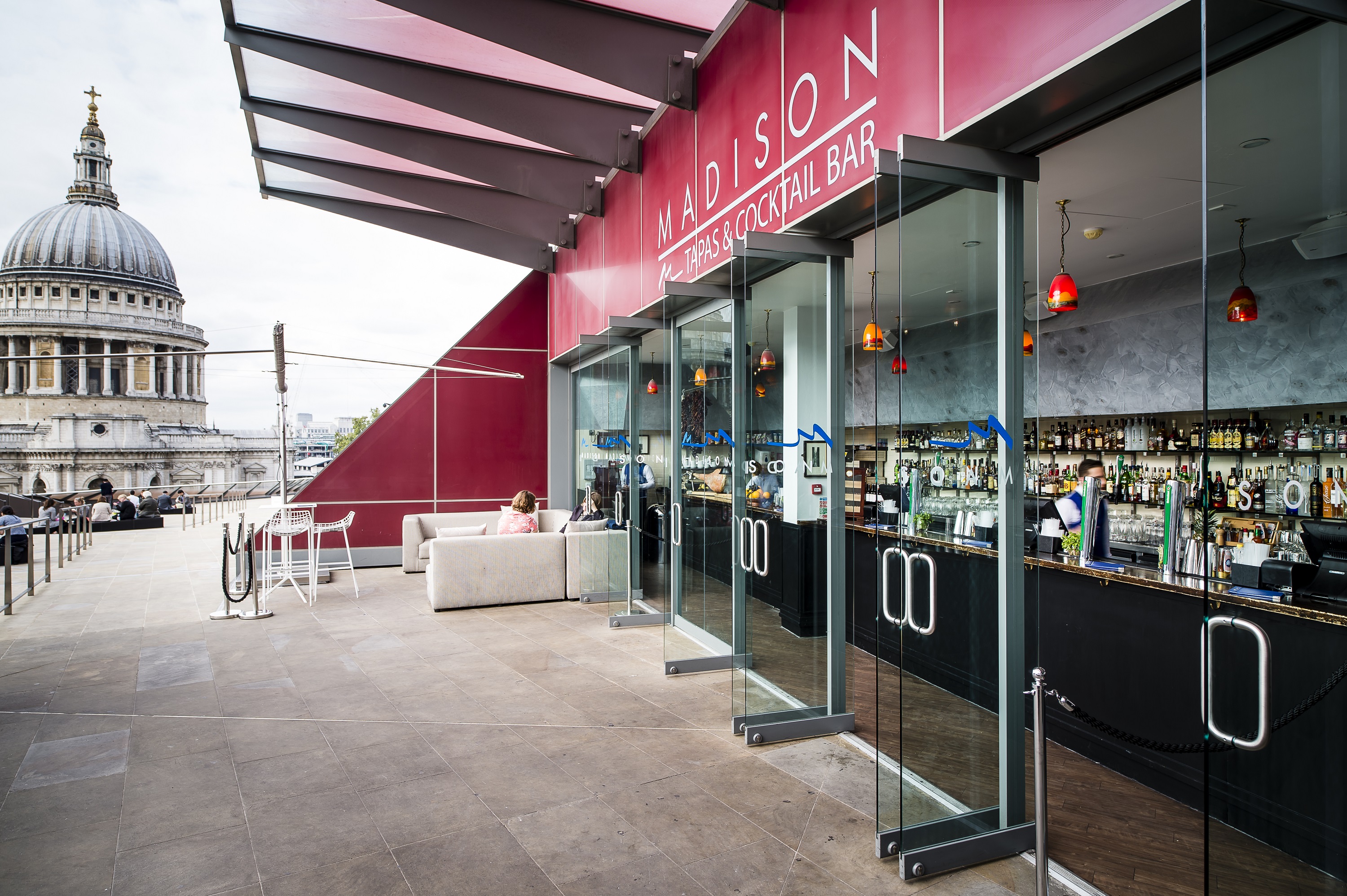 Stylish rooftop venue in Madison with bar and views of St. Paul's Cathedral for upscale events.