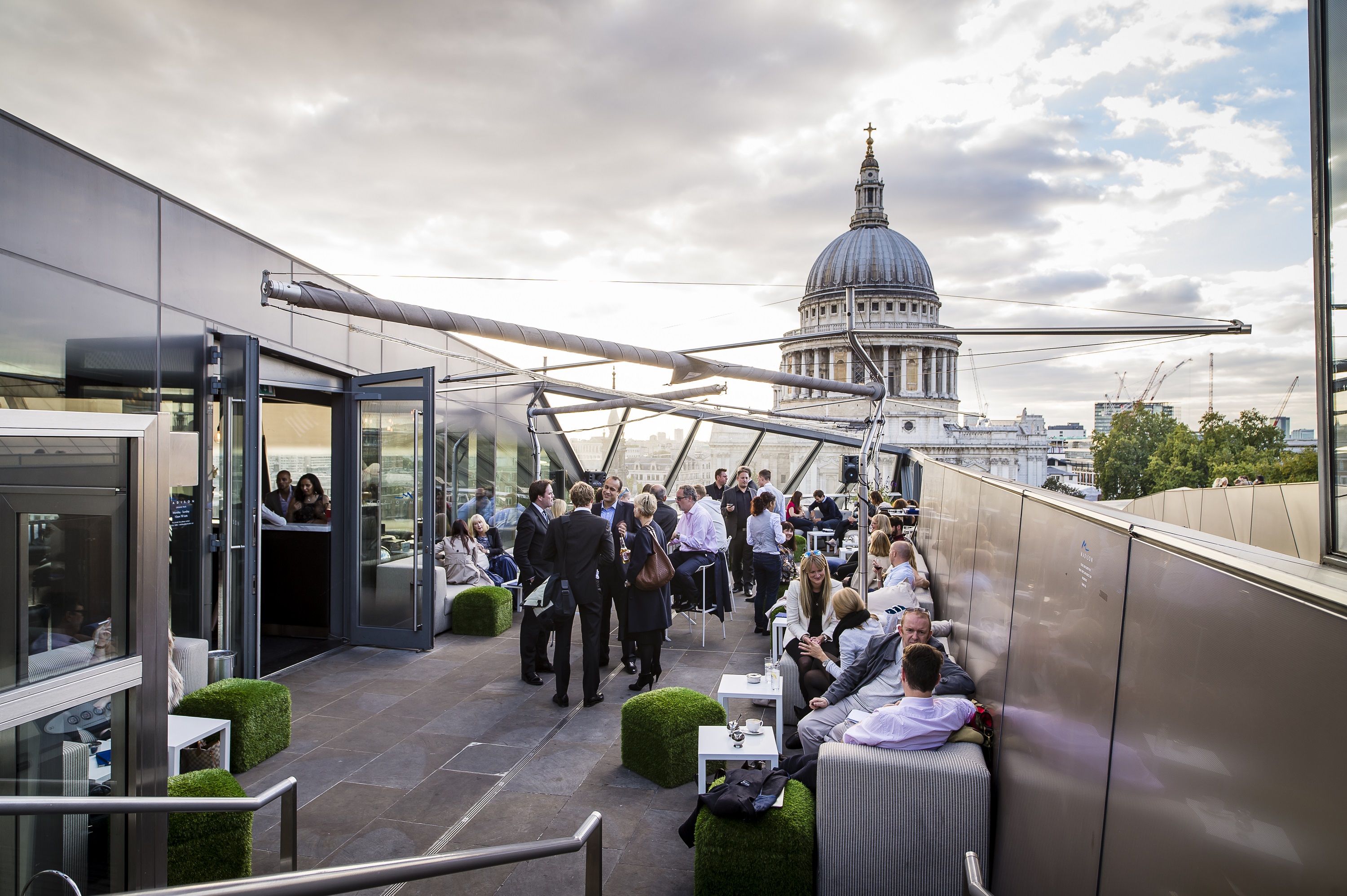 Vibrant rooftop event space in Madison with St. Paul's Cathedral backdrop, ideal for gatherings.