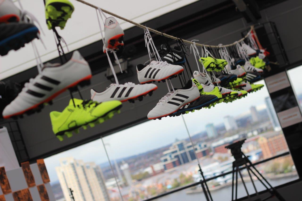 Soccer cleats display at Hotel Football for sports-themed events and product launches.