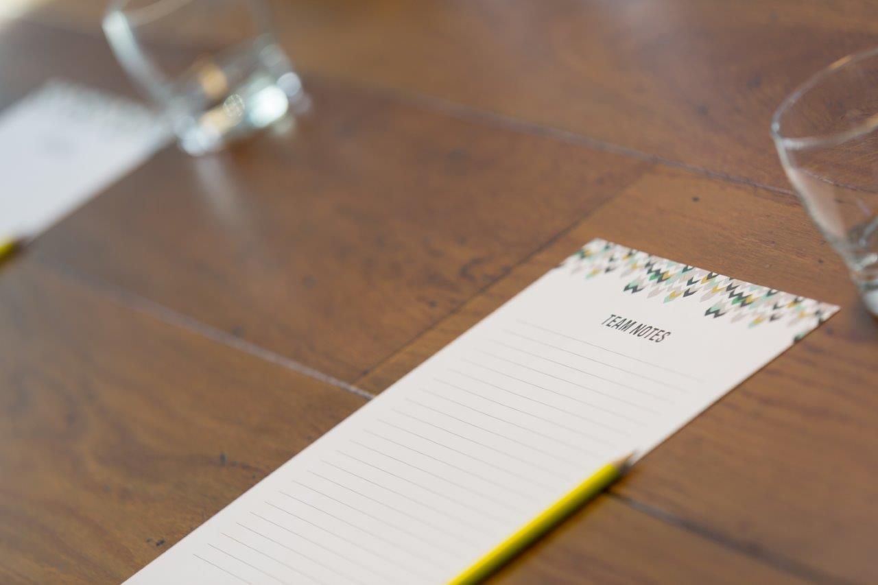 Meeting setup in Hotel Football's 92 Suite with elegant floral decor and polished table.