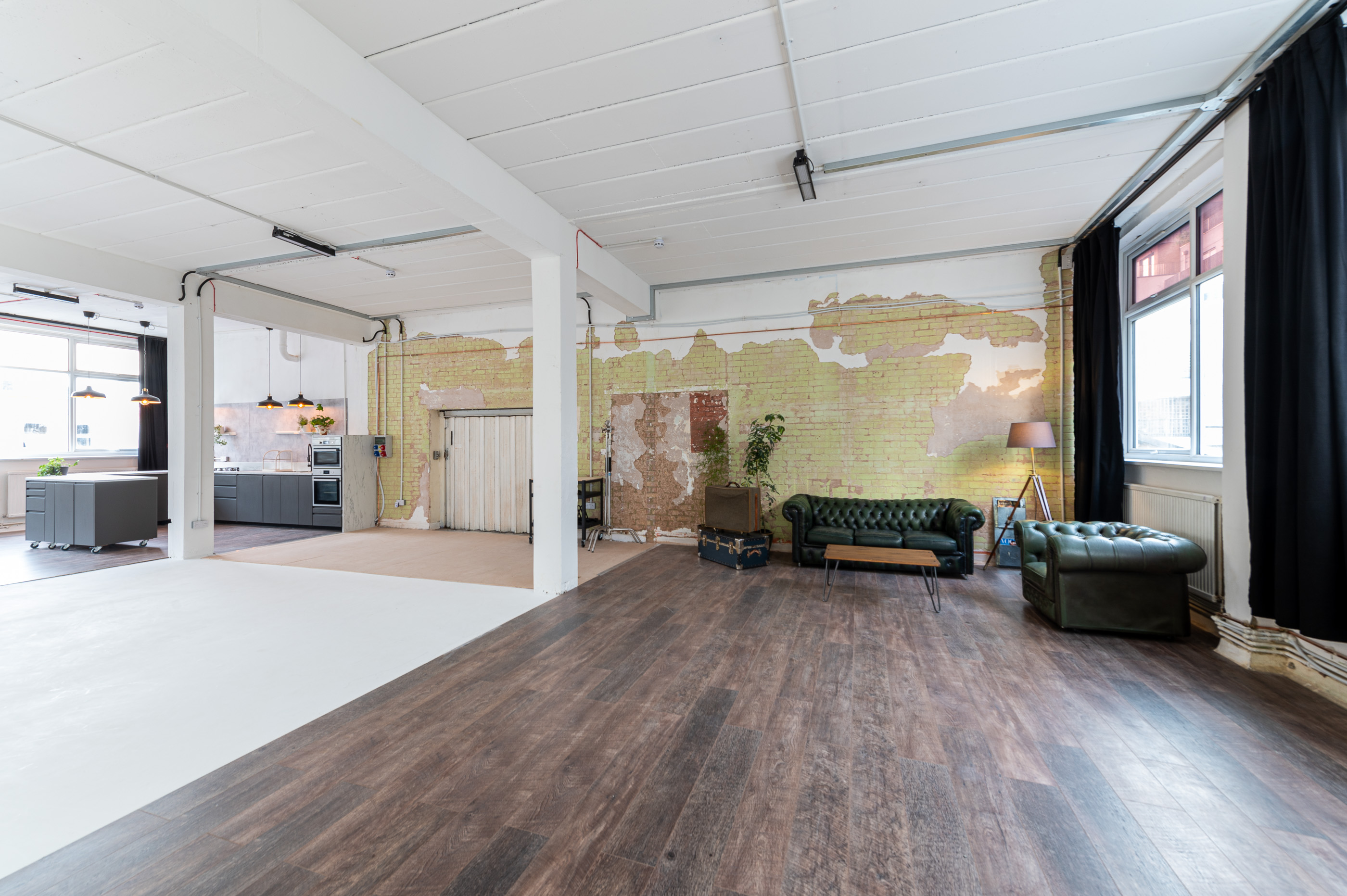 Versatile event space with exposed brick, ideal for workshops and networking events.