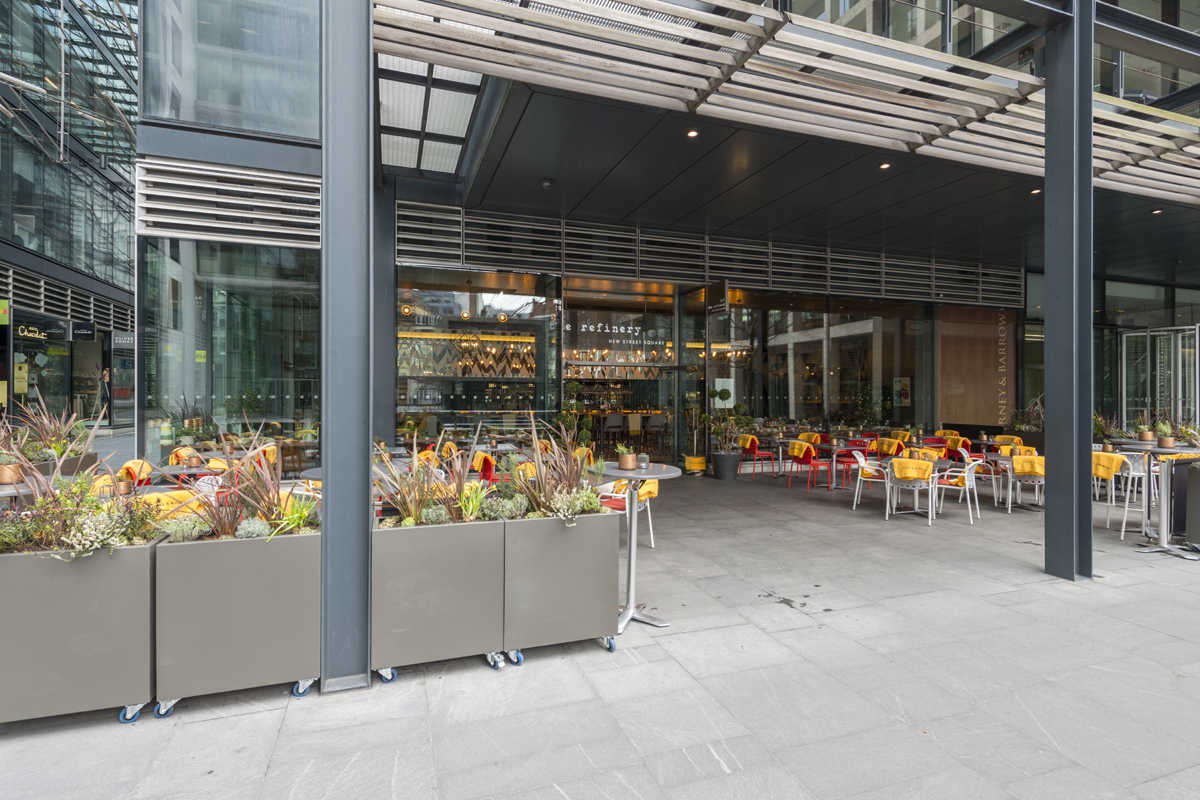 Modern outdoor dining venue at The Refinery, ideal for casual meetings and events.