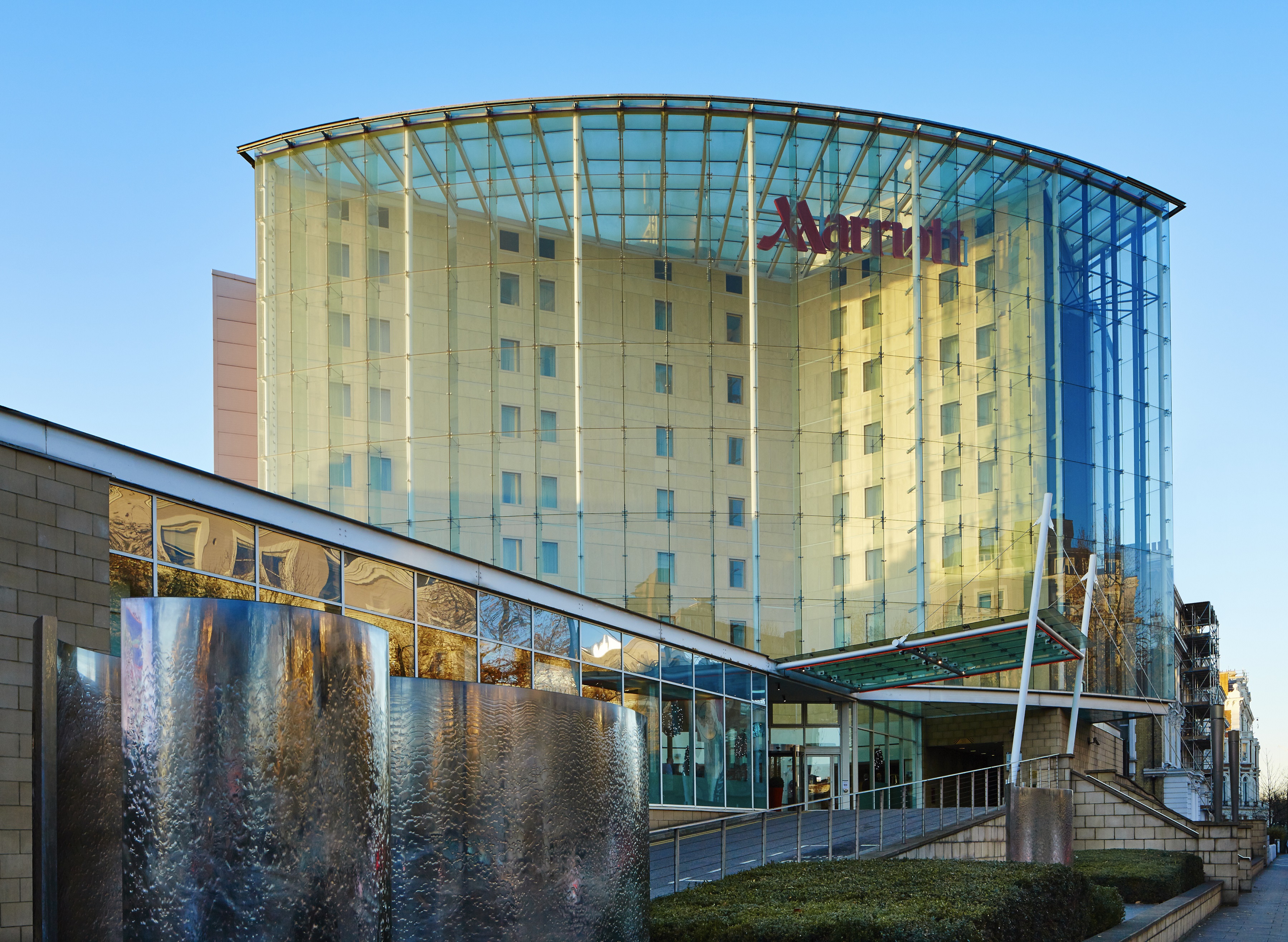 Modern hotel with glass facade, perfect for corporate events in London.