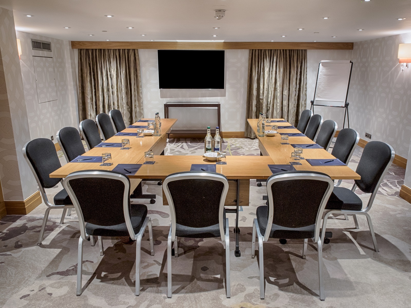 Holland Suite meeting room at Hilton London Kensington, U-shape setup for corporate events.