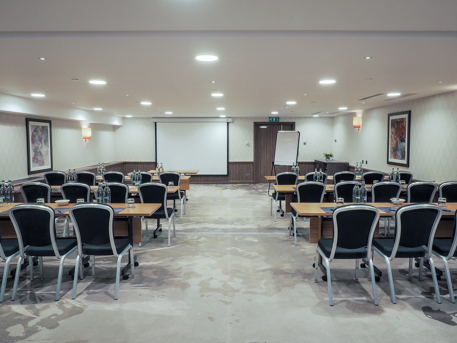 Chelsea Room at Hilton London Kensington, ideal for workshops with natural light and projector.