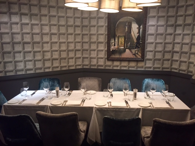 Elegant private dining room with a well-set table for corporate dinners and gatherings.