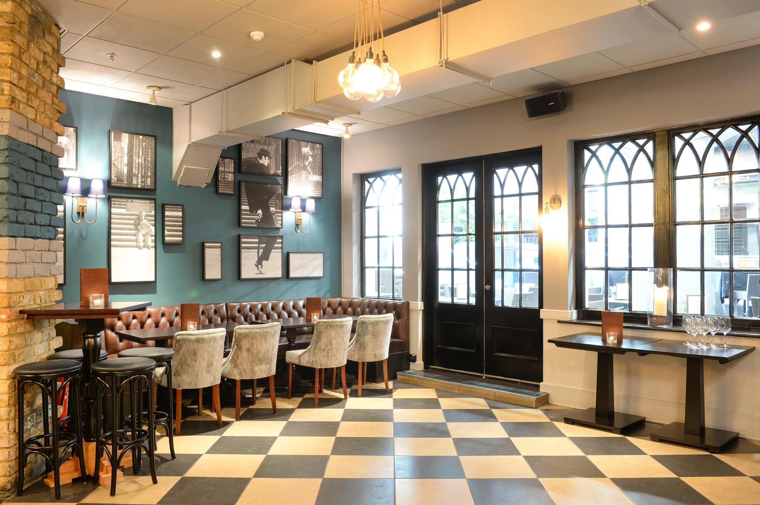 Main Bar at Balls Brothers: stylish venue with checkered floor for networking events.