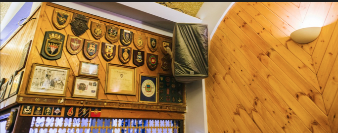 Main Hall in Moth Club, adorned with awards, ideal for events and networking.