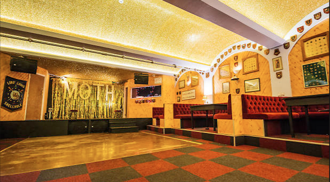 Vibrant Moth Club Main Hall with textured ceiling, perfect for events and gatherings.