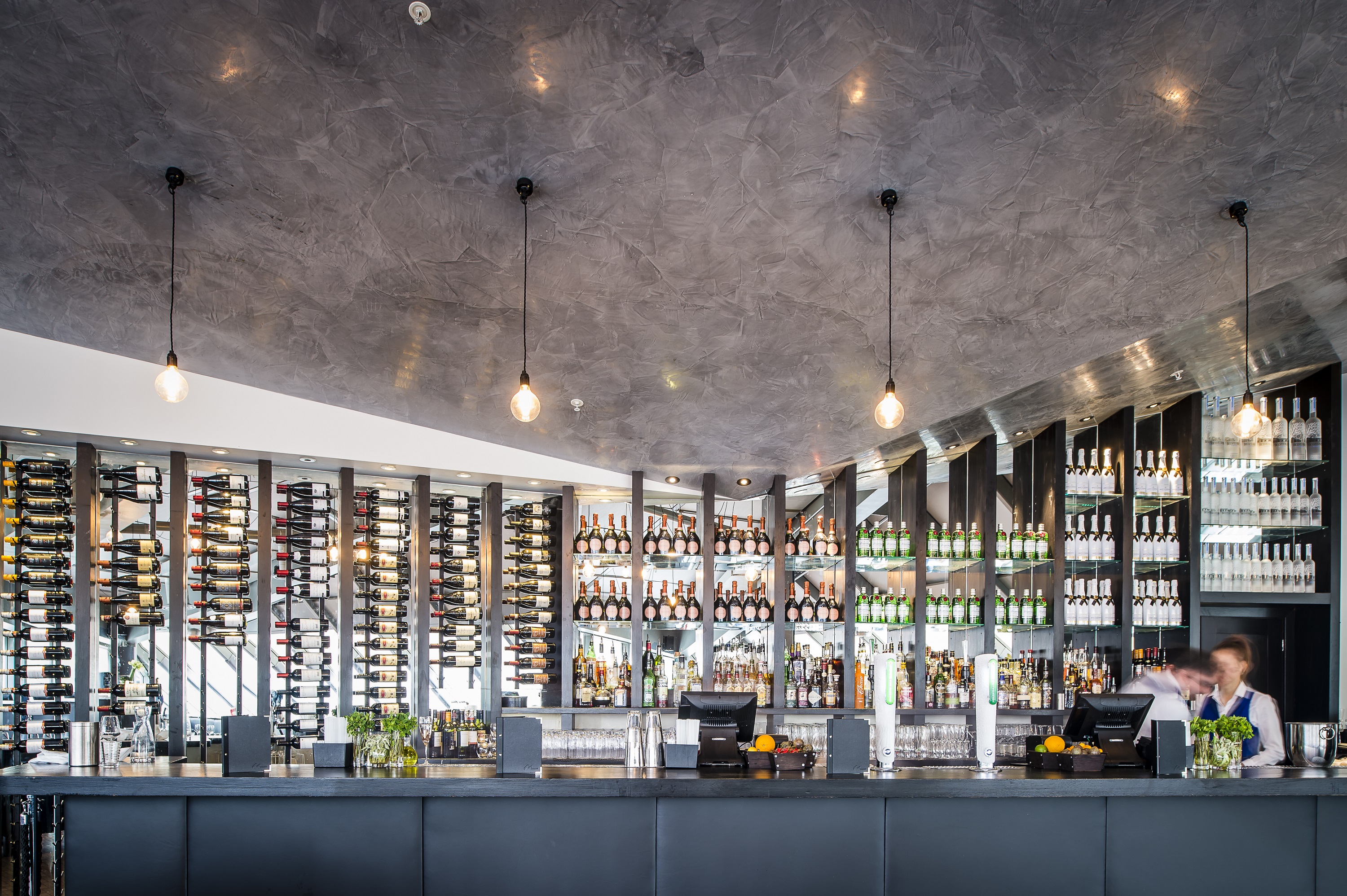 Sleek Bar Lounge in Madison with wine display, perfect for cocktail receptions and events.