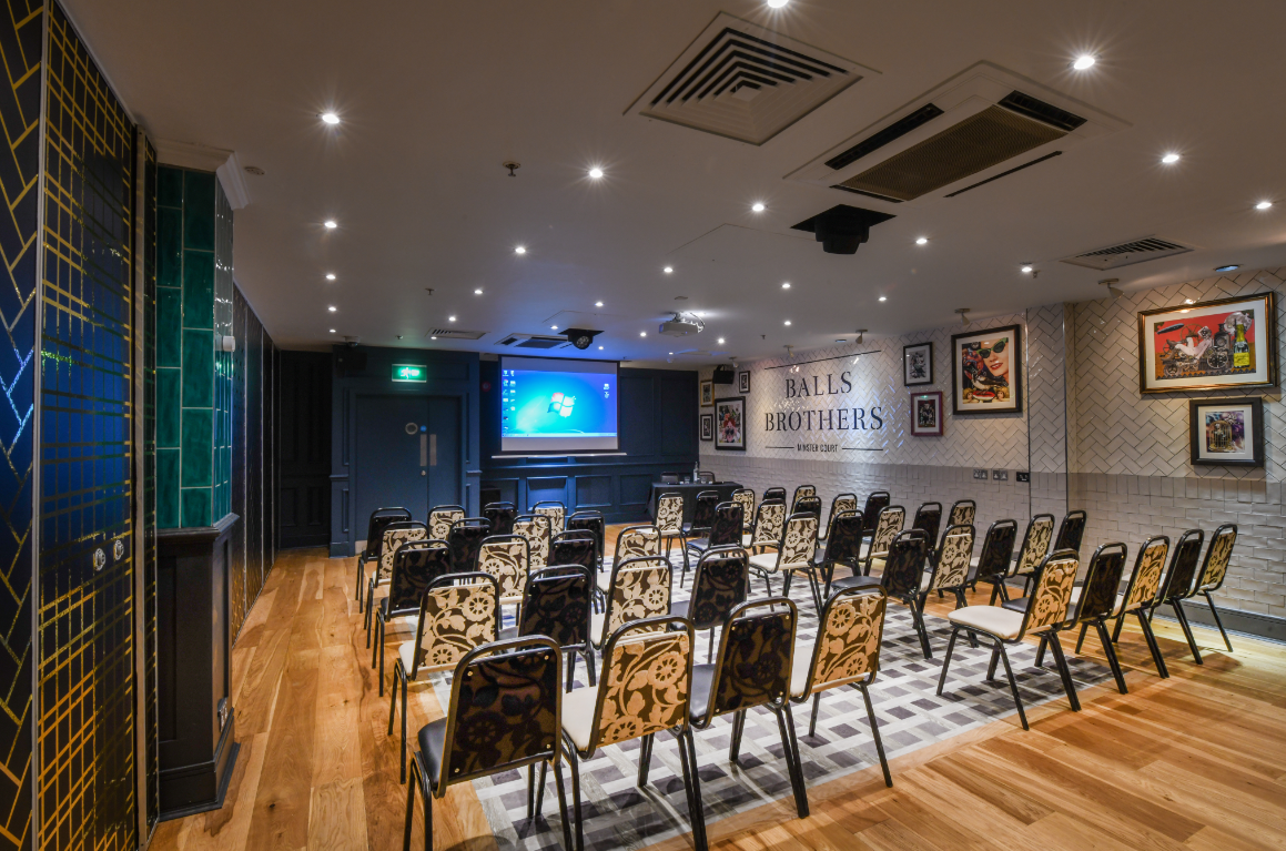 Minster Suite meeting room with theater seating, ideal for presentations and workshops.