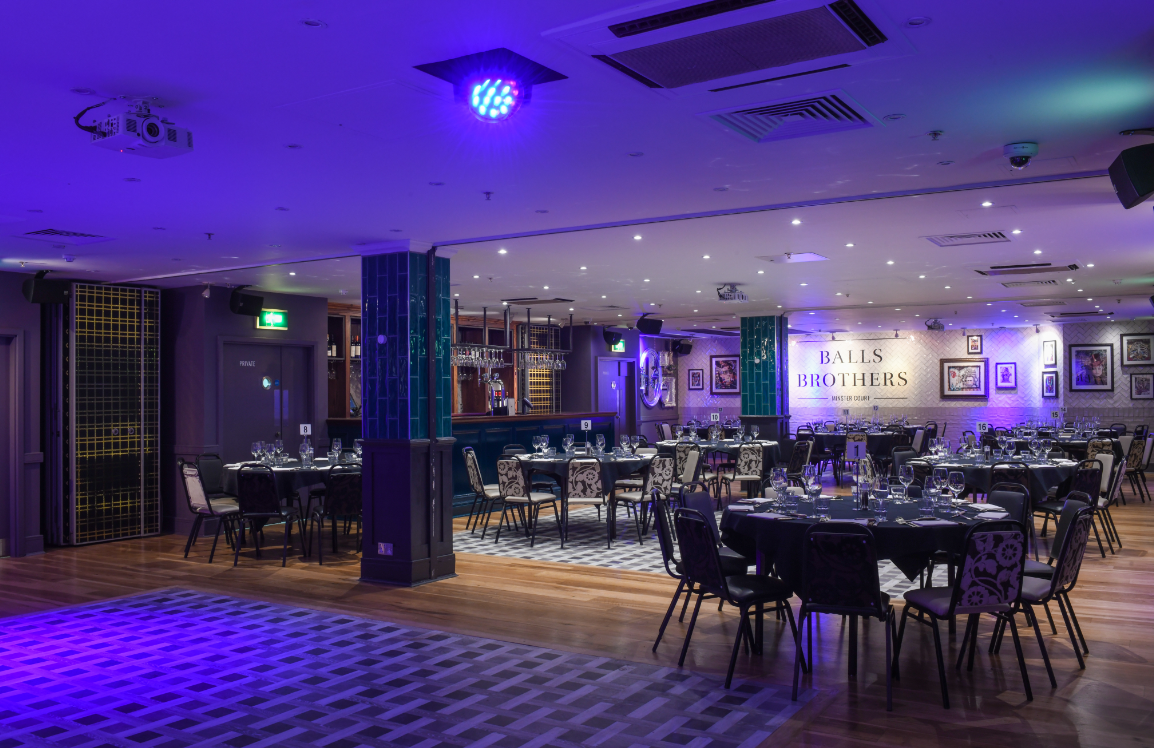 Elegant Minster Suite dinner setup for corporate events and celebrations.