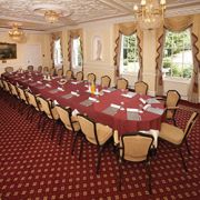 John Evelyn Room at West Lodge Park Hotel, elegant meeting space with maroon linens.