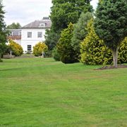 John Evelyn Room outdoor space at West Lodge Park Hotel, ideal for events with lush lawn.