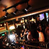 Vibrant networking venue in Suburb SW11 with warm lighting and spacious layout.