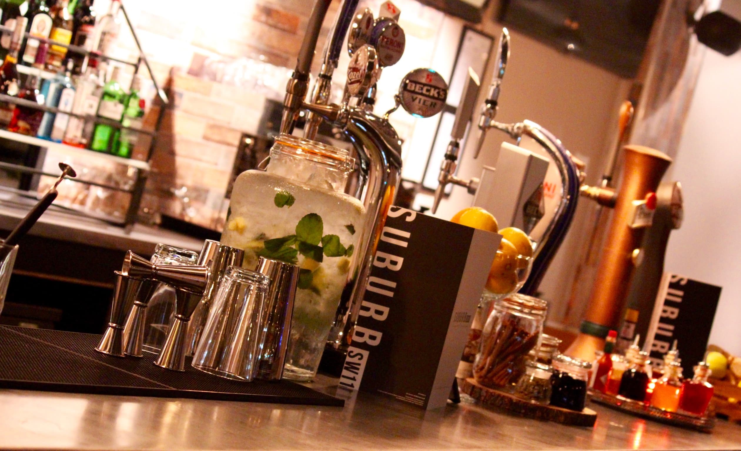 Whole Venue SW11 bar setup with sleek glassware for networking events and social gatherings.